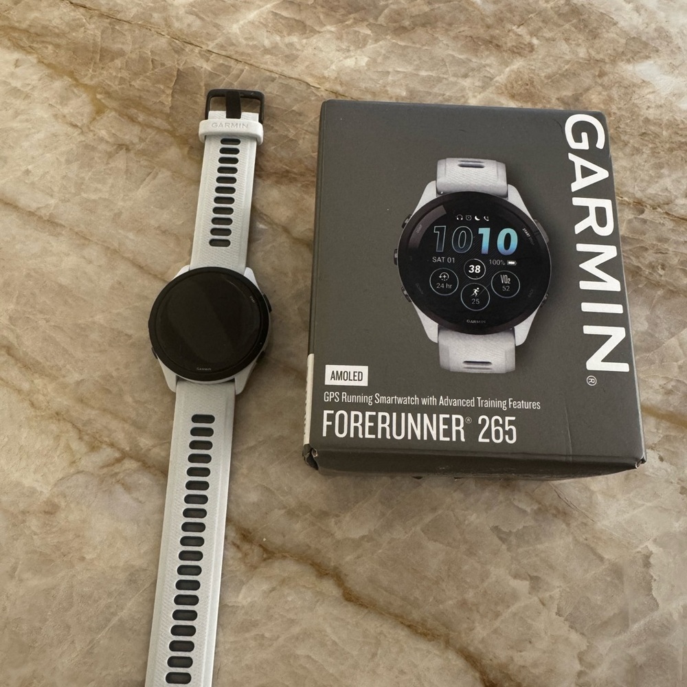 BRAND NEWGarmin Black and White Smartwatch with Sleek Design and Digital Display